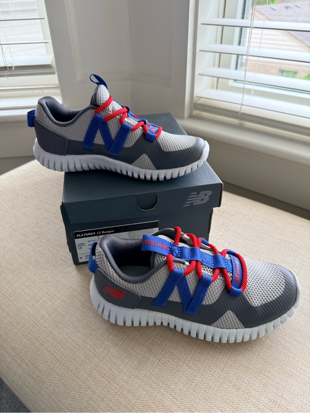 New Balance Kids Gray Sneakers with Blue Overlays & Red Laces